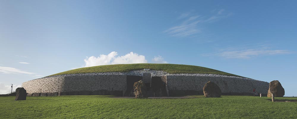 front of newgrange temple in Ireland